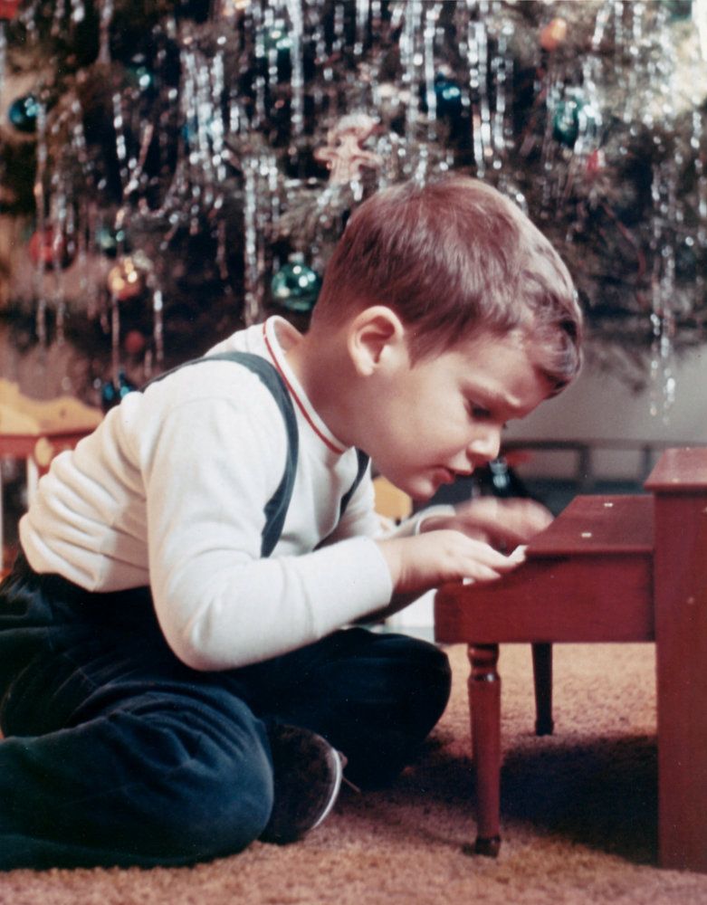An picture of me at a toy piano when I was three or four years old.